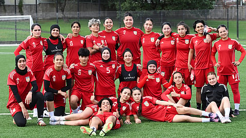 Afghan women's players pose for a team photo during a training session in Auckland, New Zealand, Tuesday, June 2, 2026.