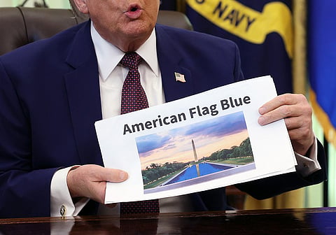 President Donald Trump displays a rendering of his proposed renovations to the Lincoln Memorial Reflecting Pool during an event in the Oval Office of the White House on June 03, 2026 in Washington, DC. The landmark is being painted as part of President Trump's efforts to repair Washington D.C. in preparation for the Nation's 250th birthday.
