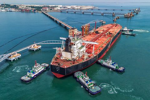Tugboats move a crude oil tanker to its berth at the oil terminal at the port in Qingdao, in China’s eastern Shandong province on June 8, 2026.