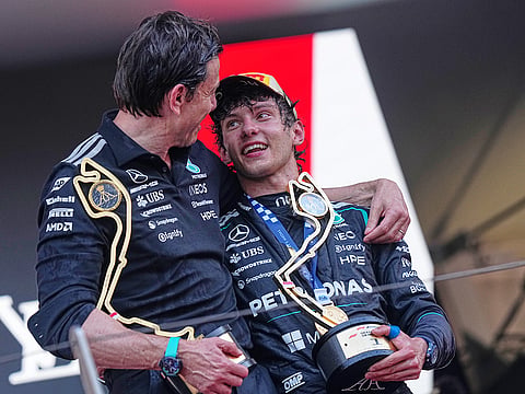 Mercedes driver Andrea Kimi Antonelli, right, of Italy, celebrates on the podium with his team principal Toto Wolff after winning the Formula One Monaco Grand Prix race at the Monaco racetrack, Sunday, June 7, 2026.