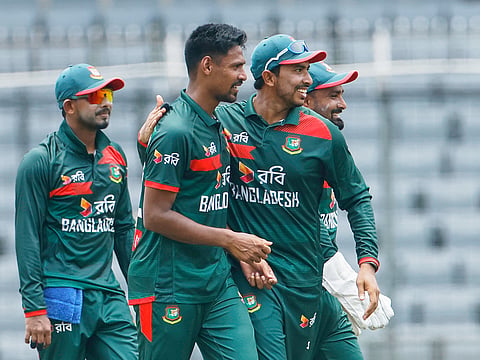 Bangladesh's Mustafizur Rahman, center, celebrates with teammates the wicket of Australia's Alex Carey during the second ODI match against Australia in Mirpur, Bangladesh, on Thursday, June 11, 2026.