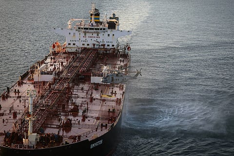 In this photo provided by the Royal Navy, Royal Marine Commandos detain sanctioned tanker, the Smyrtos, in the English Channel, Sunday, June 14, 2026. (LPhot Hutchins/Royal Navy via AP)
