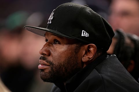 FILE - Boxer Floyd Mayweather Jr. looks on during the first half of an NBA basketball game, March 26, 2025, in New York. (AP Photo/Adam Hunger, File)