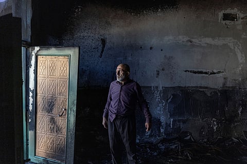 A Palestinian man inspects the damage inside a mosque reportedly burnt by Israeli settlers over night, in the Israeli occupied West Bank village of Jiljlia, just north of the West Bank city of Ramallah on June 17, 2026.