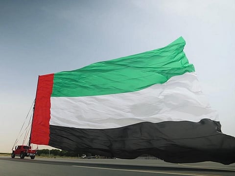 UAE flag-shaped 429.977 sq m banner sets record as largest ever lifted by a vehicle.