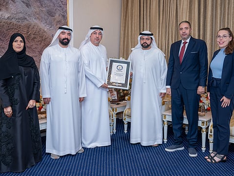 Sheikh Mohammed bin Hamad Al Sharqi with the Fujairah Fine Arts Academy team.
