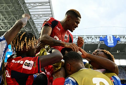 Cape Verde's forward Helio Varela celebrates with teammates after scoring his team's second goal during the 2026 World Cup Group H football match against Uruguay at the Miami Stadium in Miami Gardens on June 21, 2026.