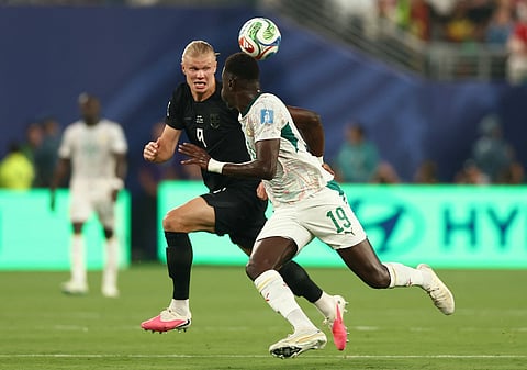 Norway's forward #09 Erling Braut Haaland and Senegal's defender #19 Moussa Niakhate fight for the ball during the 2026 World Cup Group I football match between Norway and Senegal at the New York/New Jersey Stadium in East Rutherford on June 22, 2026.