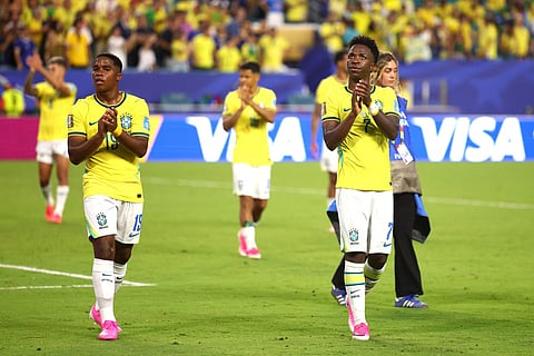 Endrick #19 and Vinicius Junior #7 of Brazil applaud fans after the 3-0 win during the FIFA World Cup 2026 Group C match between Scotland and Brazil at Miami Stadium on June 24, 2026 in Miami Gardens, Florida.