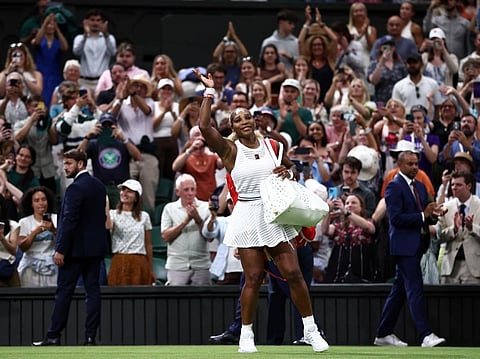 Serena Williams waves as he leaves the court after being defeated by Australia's Maya Joint during their women's singles first round tennis match on the second day of the 2026 Wimbledon Championships in London on June 30, 2026.