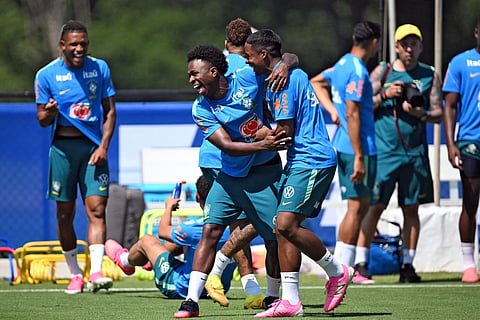 Brazil's forward #07 Vinicius Junior (C) shares a laugh with Brazil's forward #19 Endrick (C,R) during a training session at the Columbia Park Training Facility in Morristown, New Jersey on July 2, 2026, during the 2026 World Cup football tournament.