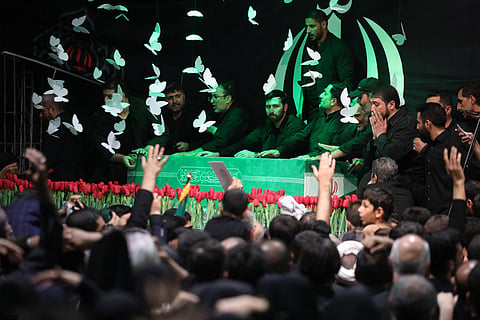 This handout picture provided by the Iranian supreme leader office shows mourners gathered around the coffin of late supreme leader Ayatollah Ali Khamenei during a ceremony ahead of his funeral at the Imam Khomeini Husseiniyeh in Tehran on July 3, 2026.