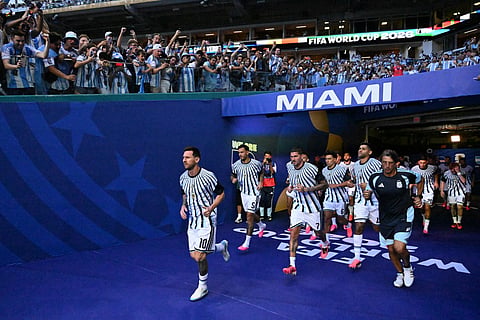 Argentina's forward #10 Lionel Messi, Argentina's midfielder #07 Rodrigo De Paul and Argentina's defender #13 Cristian Romero enter the pitch to take part in the warm-up ahead of the 2026 World Cup round of 32 football match between Argentina and Cape Verde at the Miami Stadium in Miami Gardens on July 3, 2026.