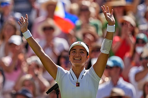 Alexandra Eala of the Philippines celebrates winning the third round women's singles match against Iga Swiatek of Poland at the Wimbledon Tennis Championships in London, Saturday, July 4, 2026.(AP Photo/Maja Smiejkowska)