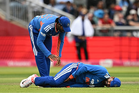 India's Shreyas Iyer hurts himself making a stop in the field during the second Twenty20 (T20) international cricket match between England and India at Old Trafford in Manchester, north-east England on July 4, 2026.