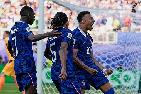 France's Kylian Mbappe celebrates after scoring from the penalty spot the opening goal during the World Cup round of 16 soccer match between Paraguay and France in Philadelphia, Saturday, July 4, 2026.