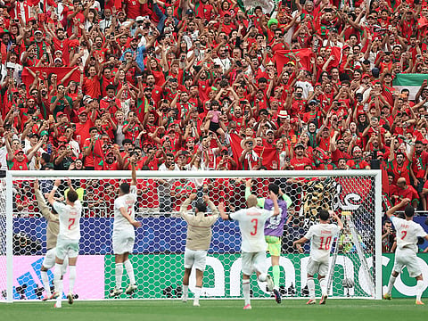 Moroccan fans celebrate with the players after winning the 2026 World Cup round of 16 match avainst Canada at the Houston Stadium in Houston on July 4, 2026.