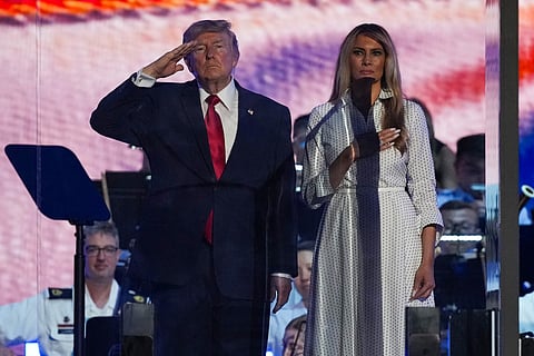 President Donald Trump and first lady Melania Trump stand on stage during "Salute to America 250" Fourth of July celebrations on the National Mall on July 04, 2026 in Washington, DC. Americans are celebrating the nation’s 250th anniversary amidst an extreme heat wave bringing dangerous triple digit temperatures to much of the eastern United States.