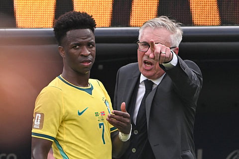 Brazil's Italian head coach Carlo Ancelotti speaks with Brazil's forward #07 Vinicius Junior during the 2026 World Cup round of 16 football match between Brazil and Norway at the New York/New Jersey Stadium in East Rutherford on July 5, 2026.