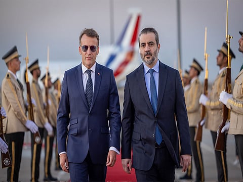 French President Emmanuel Macron and Syrian Foreign Minister Assad Hasan Al-Shaibani.