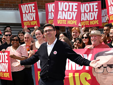 Labour party candidate Andy Burnham addresses supporters outside the Labour party campaign office in Ashton in Makerfield, northwest England, on June 18, 2026, as voters go to the polls to vote in the Makerfield by-election.