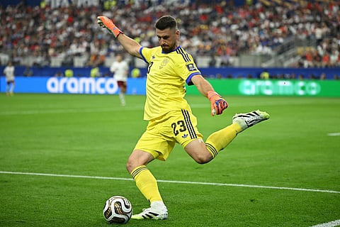Spain's goalkeeper #23 Unai Simon kicks the ball during the 2026 World Cup football tournament semi-final match between France and Spain at the Dallas Stadium in Arlington on July 14, 2026.
