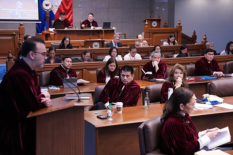 Philippine Senator Robin Padilla (C) listens during the impeachment trial for Philippine Vice President Sara Duterte at the Philippine Senate in Pasay city on July 15, 2026.