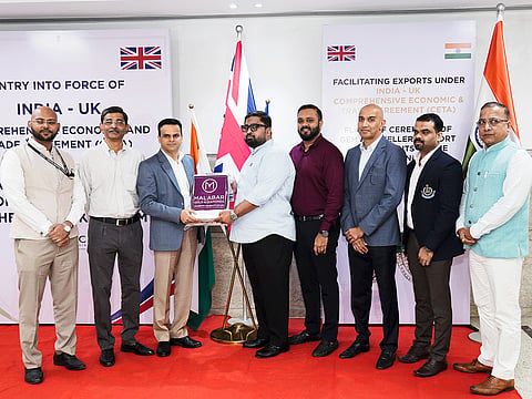 Anand Ramesh, Head of Supply Chain Management, Malabar Gold & Diamonds, hands over the inaugural jewellery consignment under the India-UK Free Trade Agreement (FTA) to Santosh Kumar Mishra, Commissioner of Customs, Precious Cargo Customs Clearance Centre (PCCCC) at Bharat Diamond Bourse in Mumbai. Also present were Haninas T.C., Deputy Manager, Export, Malabar Gold & Diamonds; Vishwajeet Chimankar, Deputy Director General of Foreign Trade (DGFT); Kiran Kumar, Joint Commissioner of Customs; Jayesh Jadhav, Assistant Commissioner of Customs; Shaunak Parikh, Vice Chairman, Gems and Jewellery Export Promotion Council (GJEPC); and Anup Zaveri, Customs Convener, Bharat Diamond Bourse (BDB).