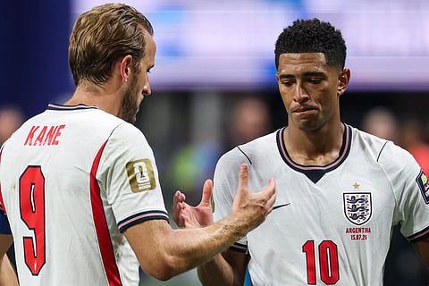 England's midfielder #10 Jude Bellingham (R) and forward #09 Harry Kane shake hands after losing the 2026 World Cup football tournament semi-final match between England and Argentina at the Atlanta Stadium in Atlanta on July 15, 2026.