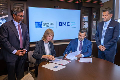 Dr. Candace S. Johnson and Dr. Mujtaba Ali Khan sign the agreement in New York in the presence of Dr. Shamsheer Vayalil and Dr. Sai Yendamuri