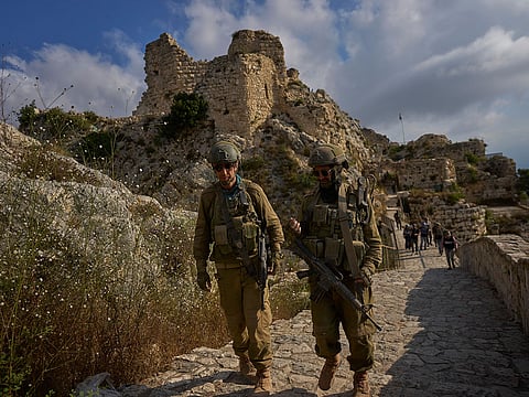 Israeli soldiers walk at the entrance to Beaufort Castle in southern Lebanon.