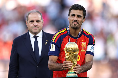 Rodri #16 of Spain kisses the FIFA World Cup Winner's Trophy as he receives the medal following the FIFA World Cup 2026 Final match between Spain and Argentina at New York New Jersey Stadium on July 19, 2026 in East Rutherford, New Jersey.