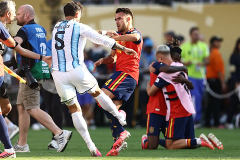 Argentina's midfielder #05 Leandro Paredes (L) clashes with Spain's defender #04 Eric Garcia at the end of the 2026 World Cup football tournament final match between Spain and Argentina at the New York/New Jersey Stadium in East Rutherford on July 19, 2026.