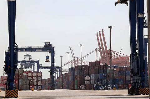 Cranes and shipping containers at a loading dock of Jeddah's Islamic Seaport on Saudi Arabia's western Red Sea coast.