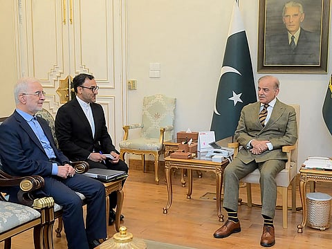 This handout photograph taken on July 21, 2026 and released by Pakistan's Prime Minister's Office shows Pakistan's Prime Minister Shehbaz Sharif (R) meeting Iranian Interior Minister Eskandar Momeni (L) at the Prime Minister House in Islamabad.