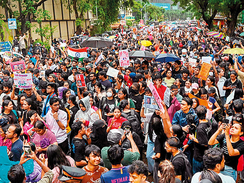 Demonstrators hold placards during a protest gathering in Mumbai on July 22, 2026 in solidarity with the ongoing protest at New Delhi's Jantar Mantar demanding the resignation of India's Education Minister Dharmendra Pradhan over alleged NEET exam irregularities.