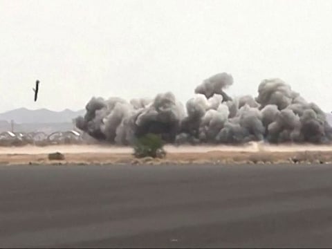 This screen grab taken from video footage released by the Houthi rebels' Al-Masirah TV channel and made available via AFPTV on July 13, 2026, shows airstrikes hitting Sanaa airport.