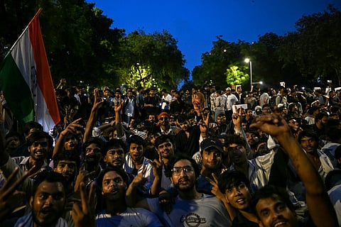 Cockroach Janta Party (CJP) supporters shout slogans at Jantar Mantar in New Delhi on July 23, 2026 during the ongoing protest demanding the resignation of India's Education Minister Dharmendra Pradhan over alleged NEET exam irregularities.