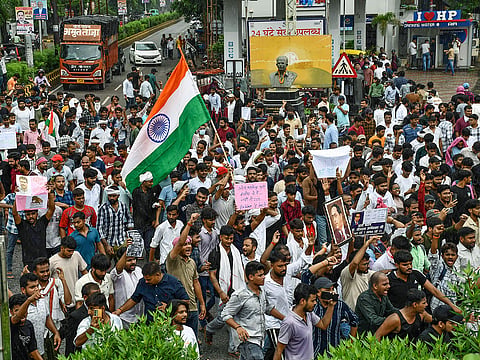 Students stage a protest in support of the Cockroach Janata Party (CJP), demanding the resignation of Union Education Minister Dharmendra Pradhan over alleged examination irregularities and NEET paper leak, in Prayagraj on Saturday.
