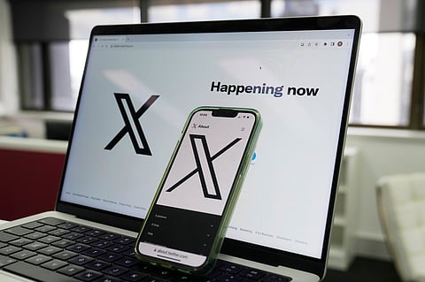 Musk has long talked about turning X into an “everything app” that would include financial services.
The opening page of X is displayed on a computer and phone. Photo taken on Oct. 16, 2023, in Sydney.