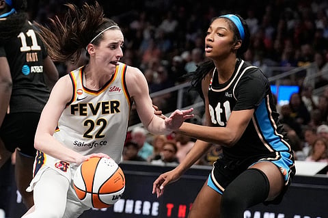 Indiana Fever's Caitlin Clark (22) dribbles the ball against Atlanta Dream forward Angel Reese (5) in the second half of an WNBA basketball game Sunday, Aug. 16, 2026, in Atlanta. (AP Photo/Brynn Anderson)