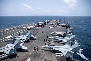 File photo: US sailors work on the flight deck of USS George Washington (CVN 73), as the aircraft carrier transits the Arabian Sea.