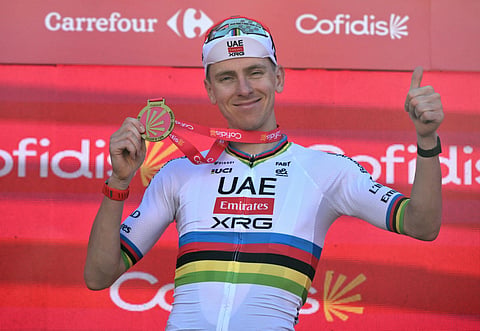 UAE Team Emirates - XRG team's Slovenian rider Tadej Pogacar celebrates on the podium after winning the fourth stage of the Vuelta a Espana 2026, a 104,8 km race between Andorra-la-Vella and Andorra-la-Vella on August 25, 2026.
