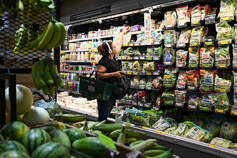People shop for groceries at a supermarket in Manhattan on August 25, 2026 in New York City.