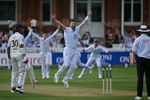 England's Ollie Robinson appeals successfully for a LBW decision against Pakistan's Azan Awais on day four of the second test match between England and Pakistan at Lord's cricket ground in London on August 30, 2026.
