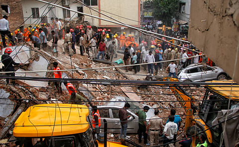 Police said the 40-50-year-old building, comprising a basement and five upper floors, collapsed at around 1.30pm.