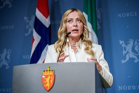 Italian Prime Minister Giorgia Meloni delivers a press conference. Meloni links veil ban and foreign student limits to integration push
