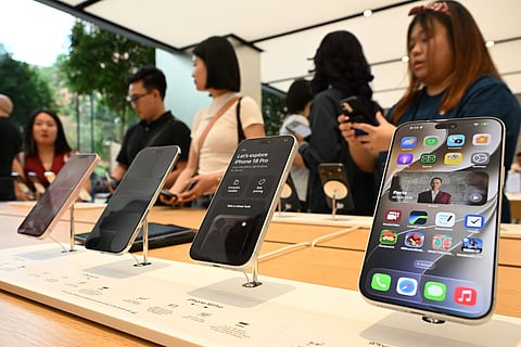 People visit an Apple store during the launch of the iPhone 18 series in Singapore on September 18, 2026.