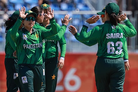 Pakistan's players celebrate their victory in the women's bronze medal cricket match between Bangladesh and Pakistan during the 2026 Asian Games at Korogi Athletic Park in Nisshin, Aichi prefecture on September 22, 2026.