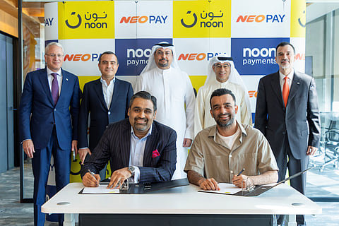 Vibhor Mundhada, CEO of NEOPAY, and Faraz Khalid, CEO of noon, ink the pact ahead of the stake sale. The deal was overseen by noon Chairman Mohamed Alabbar and other officials.